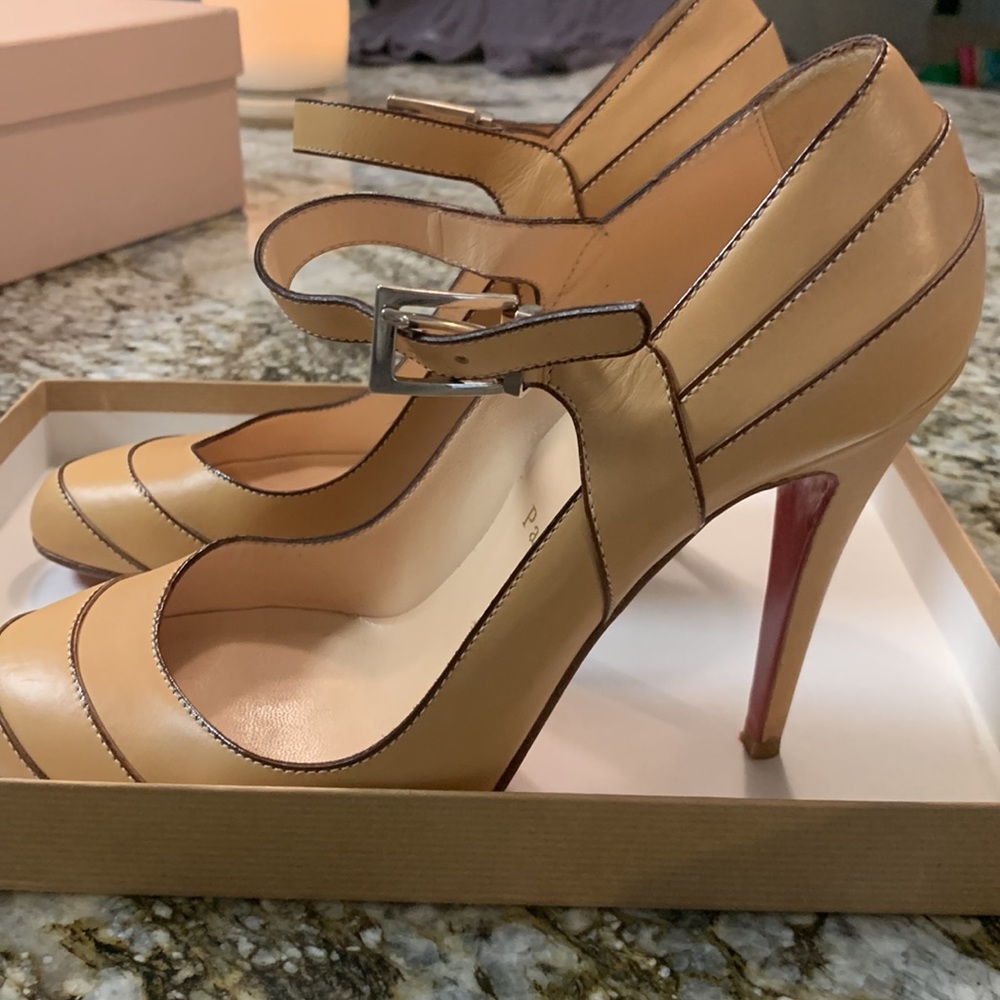 Louboutin natural heels.  Worn only once or twice.